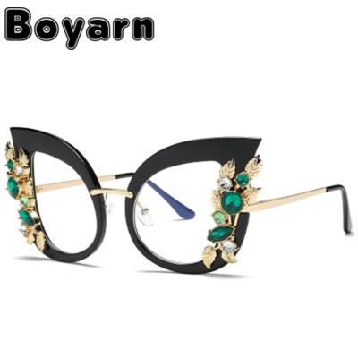 China Fashion Cat Eyes Women Sunglasses Rim Frame Big Less Metal Fashion Brand Designer Glasses Retro Custom UV400 Sunglasses for sale