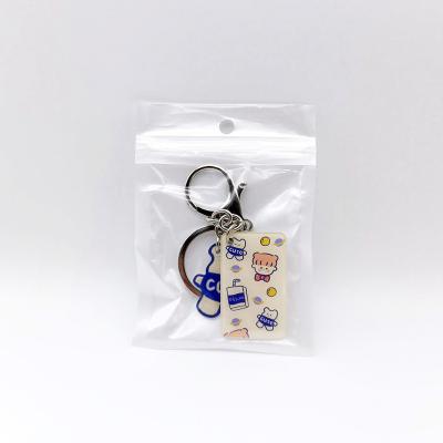 China Popular A key chain has two pieces of acrylic material on it and each of them are printed with cute patterns on one side for sale