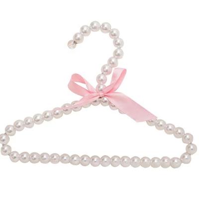 China Fashionable And Cute Hot Selling Eco-friendly Pearl Baby Pink Coat Hangers With Bow for sale