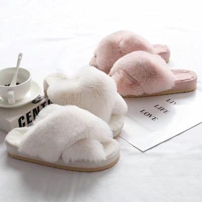 China Pink women's fashion trend band 15mm fur flurry cross slippers customized by Cixi aida, 3.5cm high rubber unique soft home slippers for sale