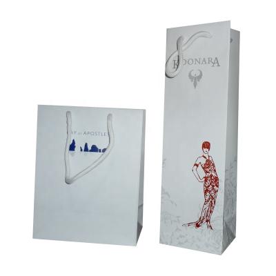 China Recyclable Biodegradable Personalized Logo Wine Card Paper Carrier Bag With Rope Handle for sale