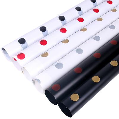 China Flower Wrapping Fashion Caramel Film Wave Dot Wrapping Paper Flower and Rose Bouquet Waterproof Materials for sale