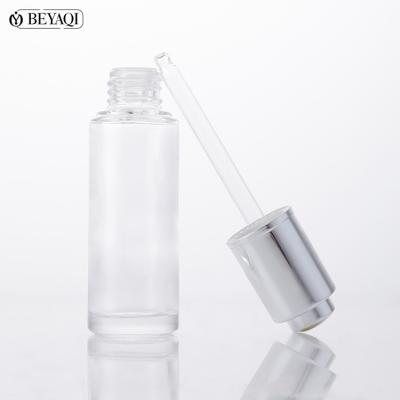 China New Developed Luxury Face Serum Cosmetics 30ml Dropper Push Button Bottle Recyclable Material Glass Serum Dropper Bottle for sale