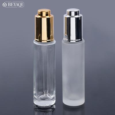 China Recyclable Material Essential Oil 30ml Empty Packaging Gold Glass Dropper Bottle for sale