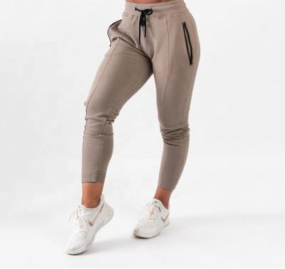 China Pants Slapped Track Pants With Zipper Pockets Empty Slim Fit Skinny Track Pants Custom Ladies Fitted Gym Joggers Khaki Pants For Women for sale