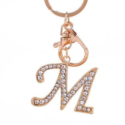 China Hot Selling 2022 Fashionable Gold Silver Car Key Ring Key Chain Inlaid Diamond Metal 26 Letters Women's Pendant Key Chain for sale