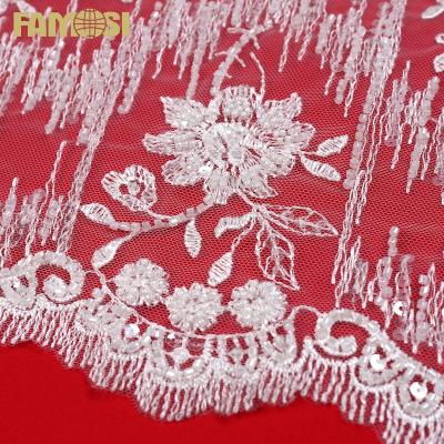 China Viable New Design Fashion White Machine Beads Lace Fabric With Clear Sequins For Wedding Dress for sale