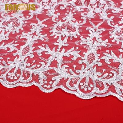 China Other order high quality french lace fabric with pearls and pearl border laces fabrics for women dresses for sale