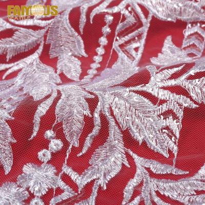 China Other Fancy Design Wholesale Tulle Sequin Beaded Embroidery Lace Fabric For Wedding Dress Making for sale