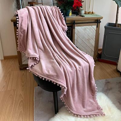 China Luxus Flannel Wearable Blankets With Pompom Fringe Lightweight Cozy Bed Blanket Soft Throw Blanket In Bed for sale