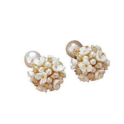 China Hyacinth Exquisite Pearl Flower Earrings 925 FASHIONABLE Silver Needle Earrings Sweet Stud For Bride for sale