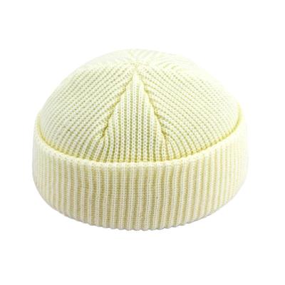 China NY COMMON High Quality Internal Sutured Custom Design Woven Logo Cotton Warm Winter Beanie Hats for sale