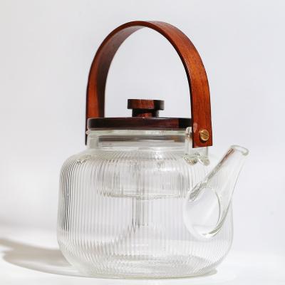 China Simple Viable Household Heat Resistant Transparent Glass Teapot Kettle With Handle And Acacia Cover for sale