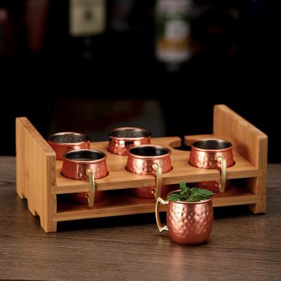 China Hot Selling Small Stocked Stainless Steel Hammered Moscow Copper Mule 6 Set Stainless Steel Mug With Wooden Stand for sale