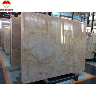 China Modern wholesale backlit translucent spider veins gold white onyx onyx for wall panel for sale