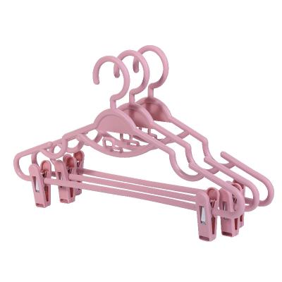 China Modern Multifunctional Pink White Household Drying Rack Plastic Pants Coats Hanger With Clip for sale