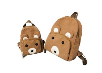 China Una mochila escolar de corduroy para niños unisex con cierre de cremallera y correas ajustables. en venta