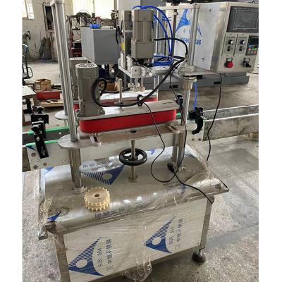 China Food Machine Automatic Linear Screw Pump Capping Disc Round Bottle Capper Machines With Lid Feeder for sale