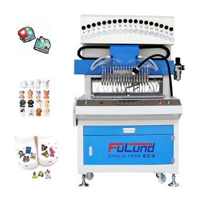 China The production of pvc silica gel products factory hot sale and factory make automatic 18 colors pvc rubber patch machine for sale