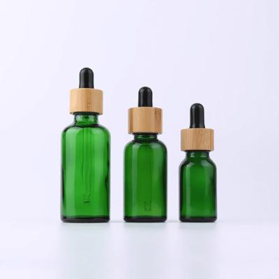 Китай капельница зеленого эфирного масла 100ml 50ml 30 Ml 15ml стеклянная разливает опарник по бутылкам бамбуковой крышки капельницы глаза косметический продается