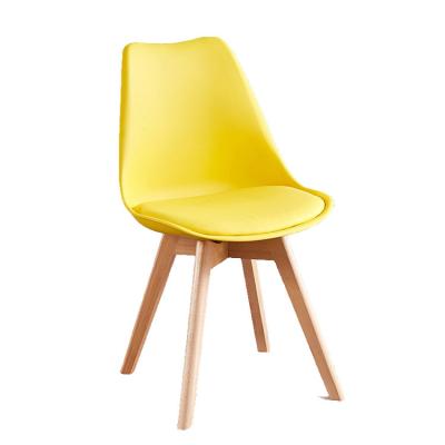 China Wholesale Cheap Price PP White Plastic Chair Cooling Modern Restaurant Colorful Dining Chairs With Wooden Legs for sale