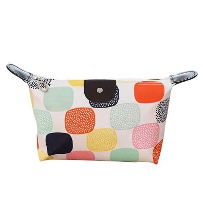 China New PU Cosmetic Waterproof Travel Fashion Bag Makeup Carrying Dumplings Folding Cosmetics Factory Direct Cosmetics for sale