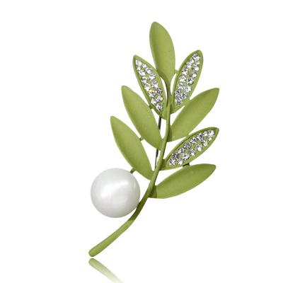 China Fashionable rushed surrounding setting inlay technology silver jewelry pipeline color material ivory brooches leaves Perl brooch for sale