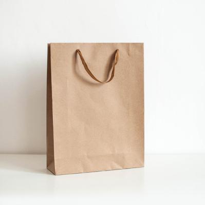 China Recycled Materials Single Pass Printer Kraft Paper Bag Eco-friendly Paper Gift Bags Luxury Paper Bag Orange Shopping Bag for sale