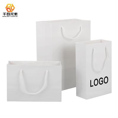 China Low Price White Cardboard Shopping Paper Bag High Quality Luxury Recyclable With Hot Stamping Paper Bags for sale