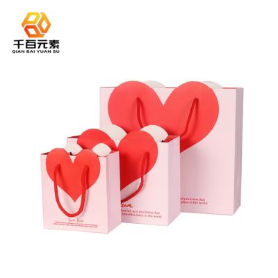 China Recycled Materials Paper Sack Portable Cute White Pink Color Paper Bags With Handles Logo for sale