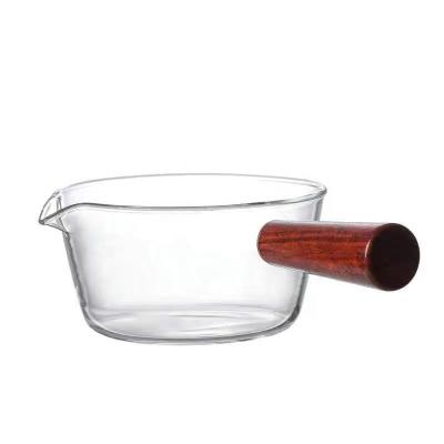 China Viable Clear Glass Pot Milk Casserole With Wooden Handle Breakfast Cooking Glass Pot Cookware For Home Kitchen Open Flame Heating Milk Pot for sale