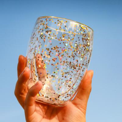 China Sustainable Creative Double Layer Insulated Double Stars Wall Borosilicate Glass Glitter Cup for sale