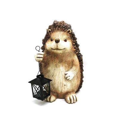 China Traditional European Style Magnesium Hedgehog Figurine With Lantern Cute Garden Statue Outdoor Garden Decoration for sale