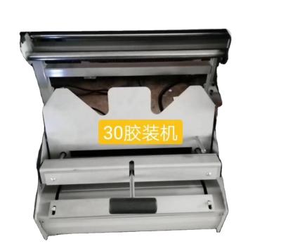 China Manual High Quality Desktop Hot Glue Melt Glue Binding Machine for A4 Paper and Books 750x450x500mm for sale