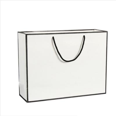 China Factory Supply Recyclable Direct Handle Paper Bag With Embossed Logo for sale