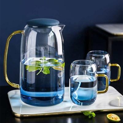 China Sustainable 1L 1.5L Borosilicate Glass Water Pitcher Carafe With Stainless Steel Lid And Silicone Neck for sale