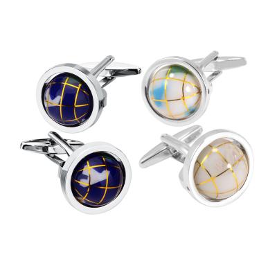 China Luxury Blue Stainless Steel Globe Moving Stone Energinox Cufflink With Leather Box for sale