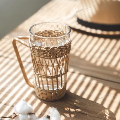 China Clear Sustainable Hot Transparent Glass Cup Water Coffee Tea Coffee Sale Glass Cup With Rattan Cup Holder for sale