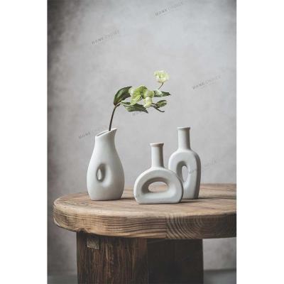 China Minimalist White Ceramic Irregular Vase Plant Handmade Art Porcelain Vases Decoration For Home for sale