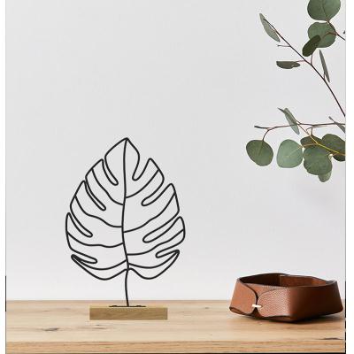 China Contemporary New Products Metal Ornament Black Home Decor Table Top Show Art Frame Stand Animal And Plant Shapes for sale