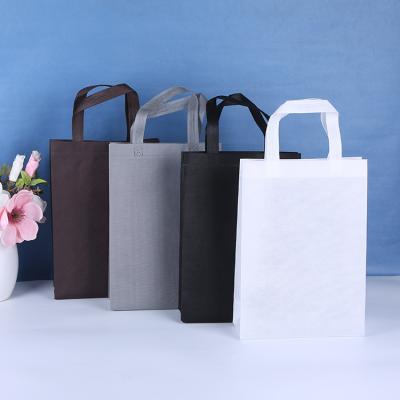 China Durable/Reusable Custom Stock Non Woven Package Logo Bag T-shirt Non Woven Gift Bag Tote Bag Packing Supermarket Shopping for sale