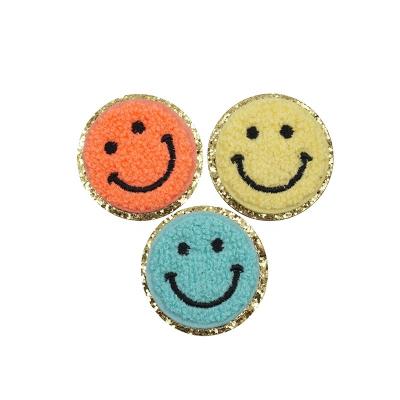 China Free sample viable wholesale caterpillar smiley face iron on logo garment decorating sticker for sale