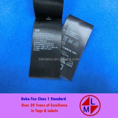 China Sustainable and luxury class1 Oeko-Tex high quality black base printed care label for sale