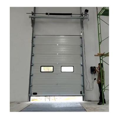 China Doorhan Industrial Vertical Sliding Door Automatic Warehouse Lift Up Sectional Door With View Window for sale