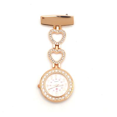 China Diamond Ladies Nurse Watch Fashion Design Luminous Metal Brooch Heart Shaped Cute Romantic Nurse Chest Watch for sale