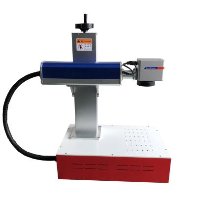 China 20W fiber laser marking machine factory price air-cooled flying automatic laser marking machine production line desktop with coveyor belt for sale