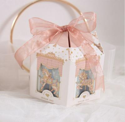 China New Recyclable Carousel Candy Box Wedding Return Gift Box Girl Heart With Hand Gift Box for sale