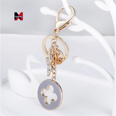 China Accessories Luxury Metal Key Chain Opal Four Clover Leaf Women Jewelry Key Chains For Women Handbag Key Decoration for sale