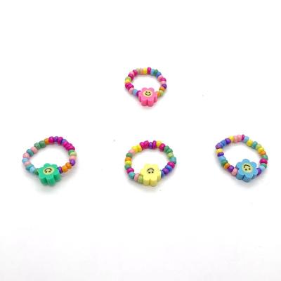 China Cute Boho Beach Rings Elastic Bead Rings Smiling Flower Beaded Rings for sale