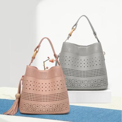 China Hollow-out fashionable simple tassel fashion shoulder handbag manufacturer direct sales for sale